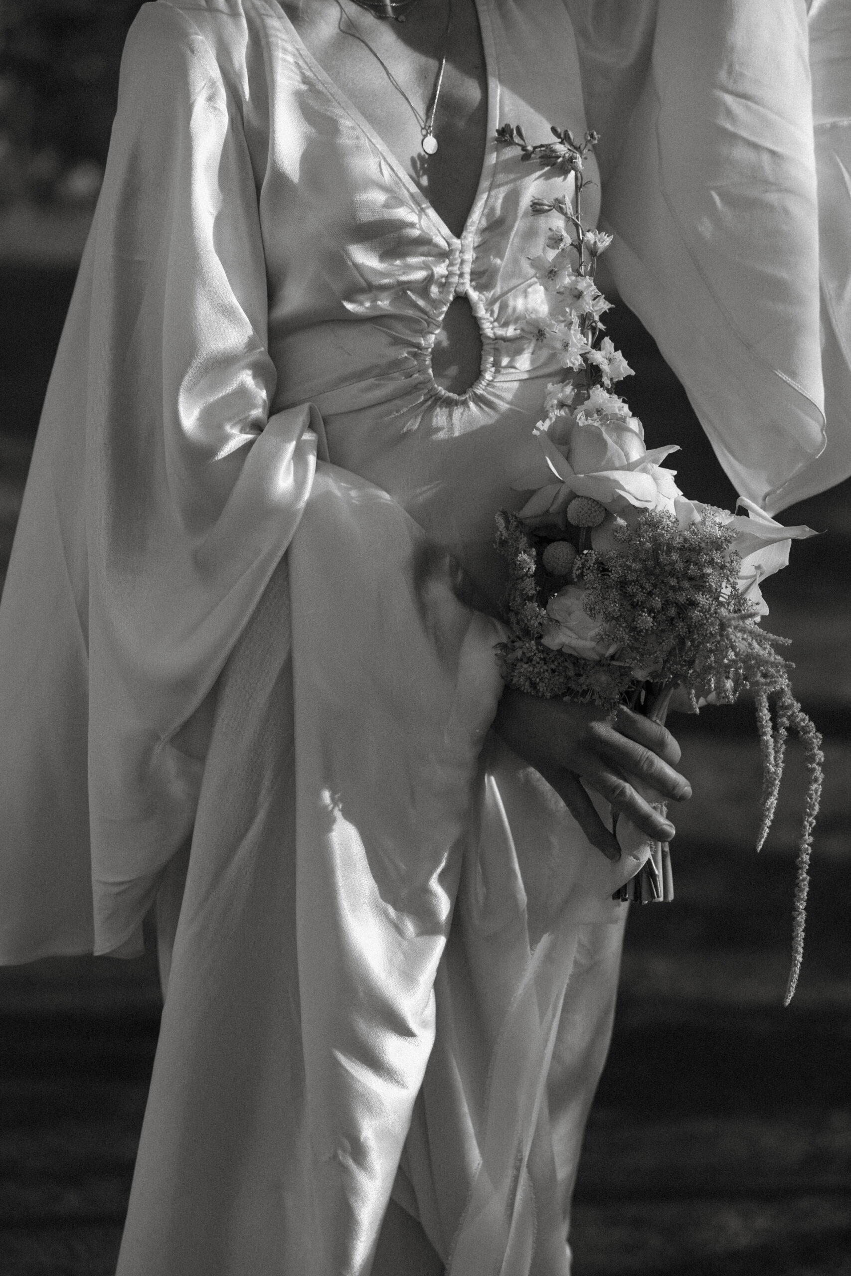 bridal detail shot of gown and bouquet