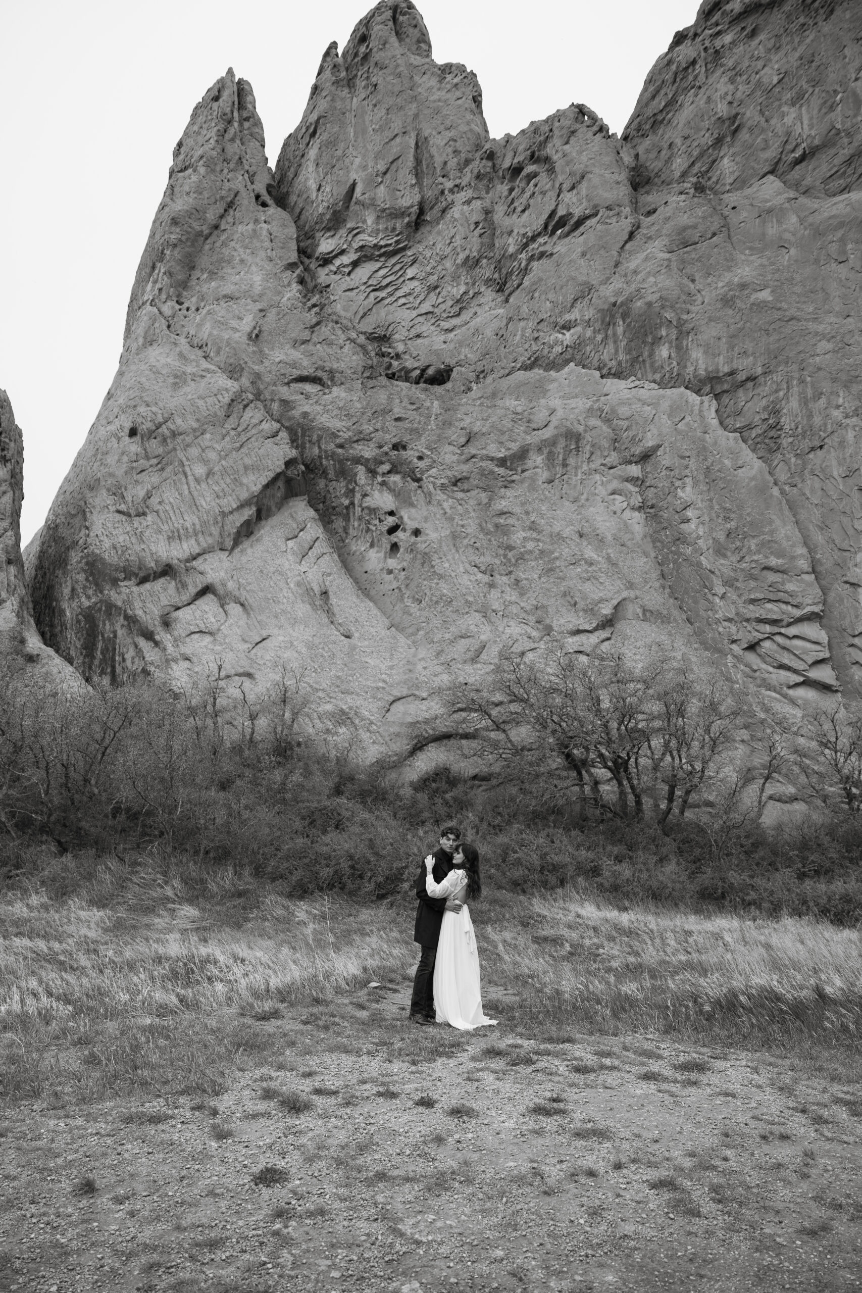 wide shot of bride and groom embracing during their elopement in Garden of the gods, Colorado