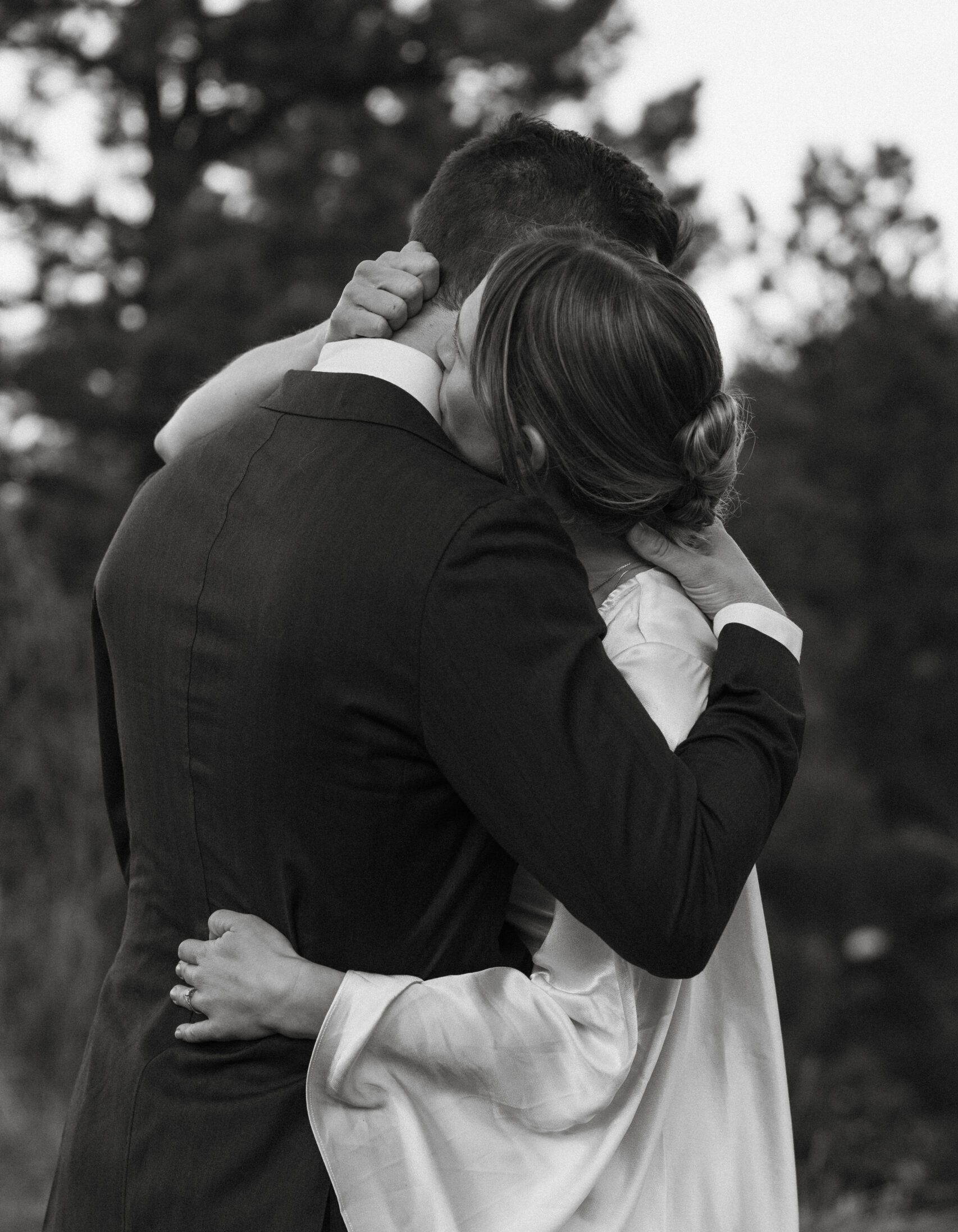 Bride and groom embrace after exchanging vows