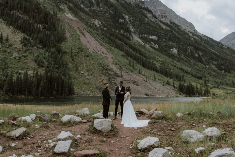 Elopement Ceremony takes place at the Maroon Bells Amphitheater in front of Maroon Lake
