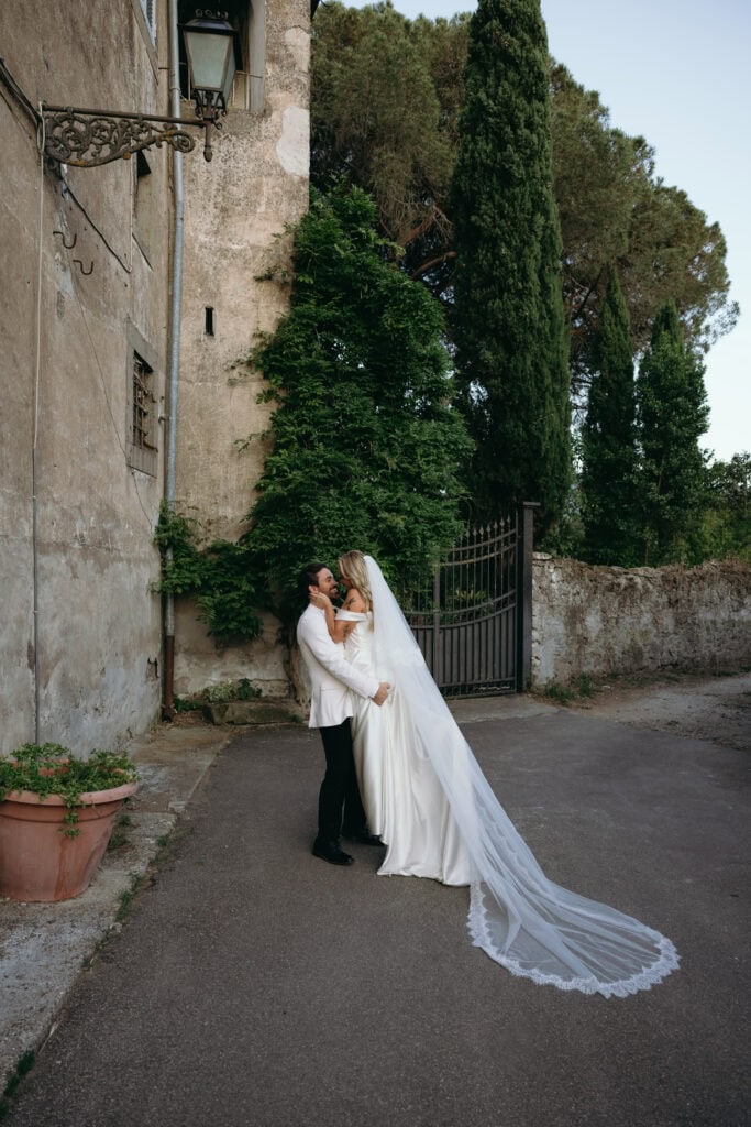 bride and groom embrace during luxury Italy wedding