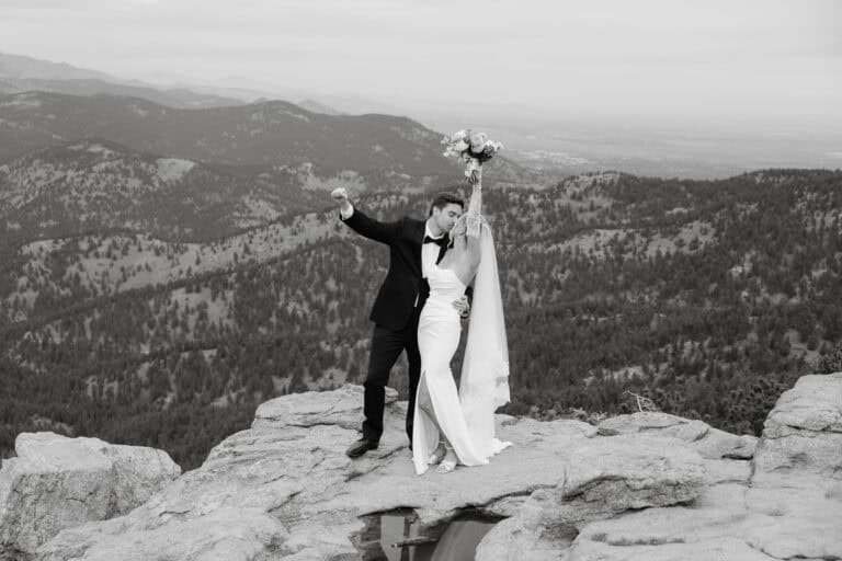 Bride and groom cheer as they kiss during their Boulder Colorado wedding